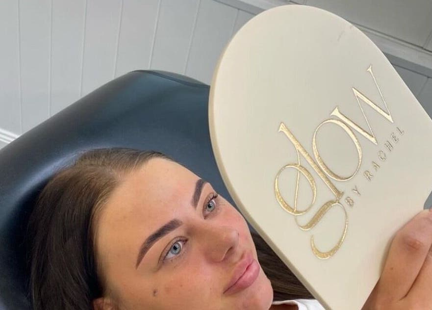 Client admiring new brows at Glow by Rachel, Sydney, New South Wales, AU.