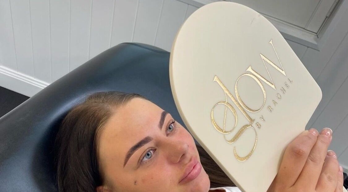Client admiring new brows at Glow by Rachel, Sydney, New South Wales, AU.