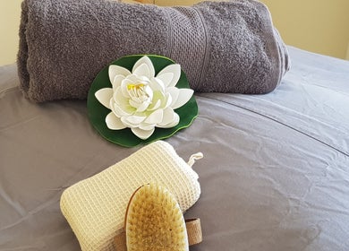 Spa essentials displayed with a flower at Mobile Service, Cape Town, Western Cape, ZA.