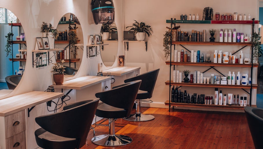 Modern interior of Citrine Hair Salon by Layla in Cape Town, Western Cape, ZA showcasing sleek styling stations.