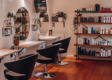 Modern interior of Citrine Hair Salon by Layla in Cape Town, Western Cape, ZA showcasing sleek styling stations.
