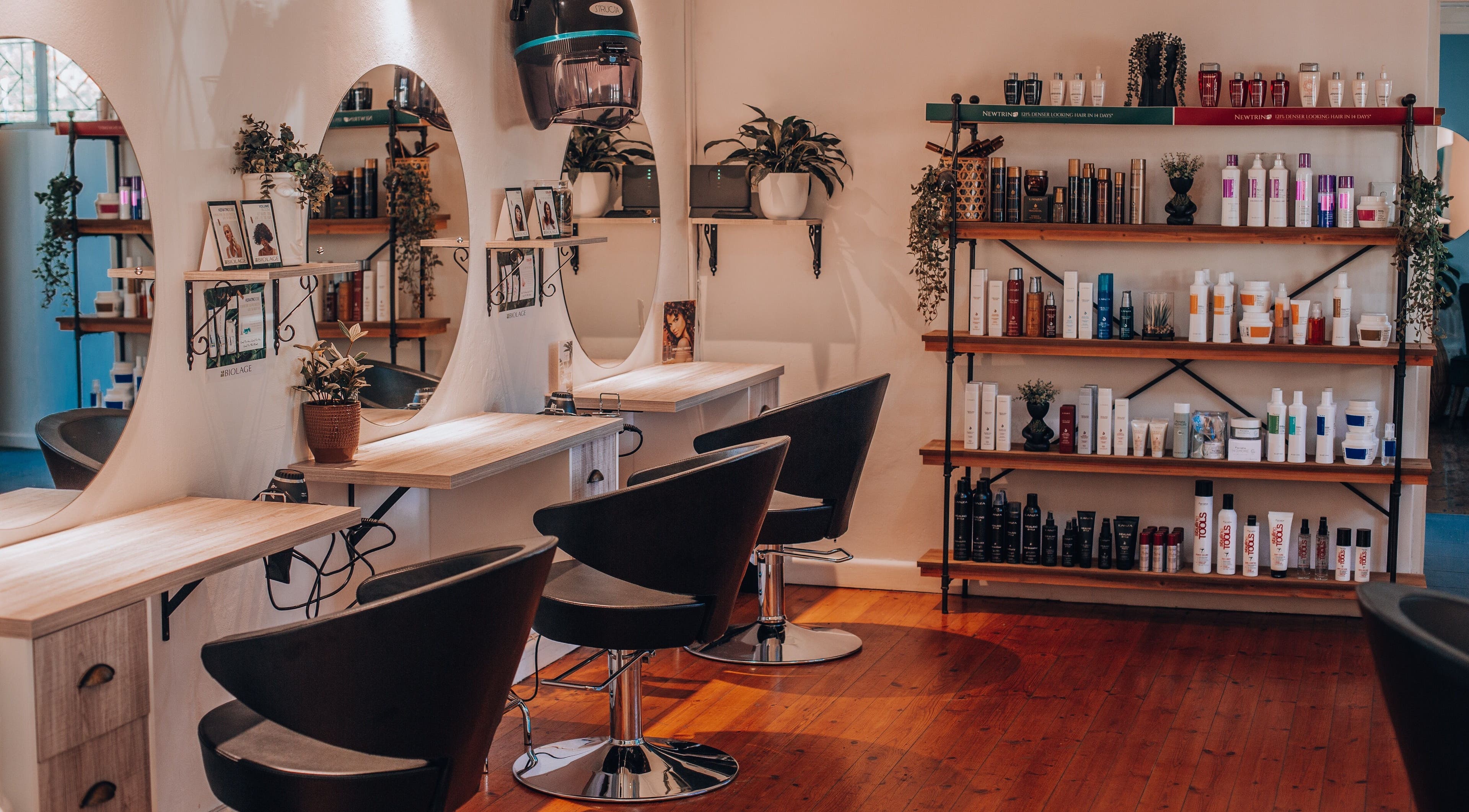 Modern interior of Citrine Hair Salon by Layla in Cape Town, Western Cape, ZA showcasing sleek styling stations.