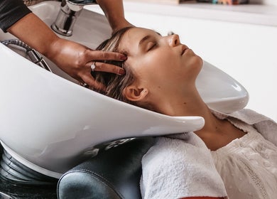 Client enjoying a relaxing hair wash at Citrine Hair Salon by Layla in Cape Town, Western Cape, ZA.