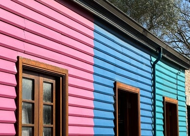 Colorful facade of Sauna on the Corner at Middleton Beach, Western Australia, AU under clear skies.