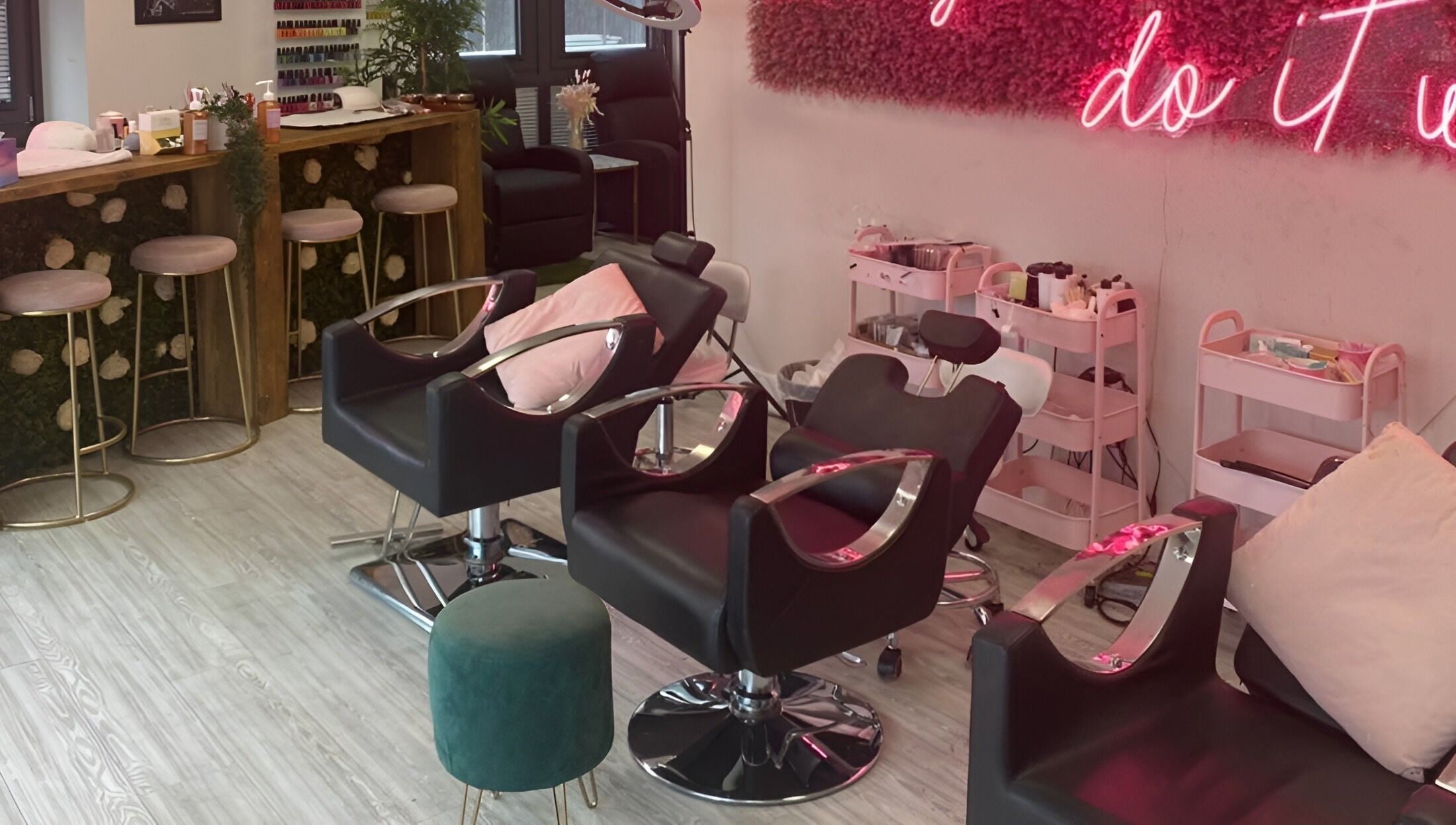 Stylish salon setup at The Beauty House, featuring chic seating and decor in Bristol, England, GB.