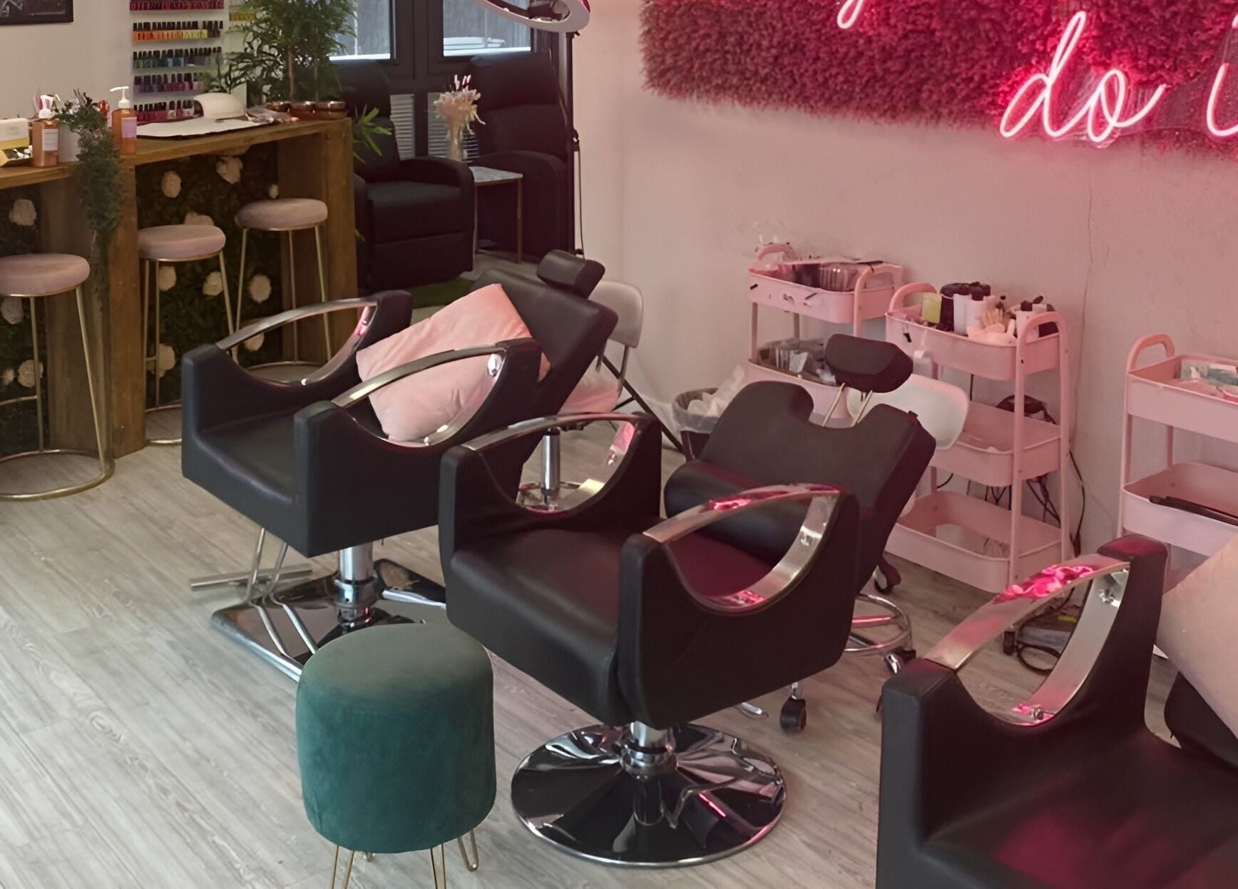 Stylish salon setup at The Beauty House, featuring chic seating and decor in Bristol, England, GB.