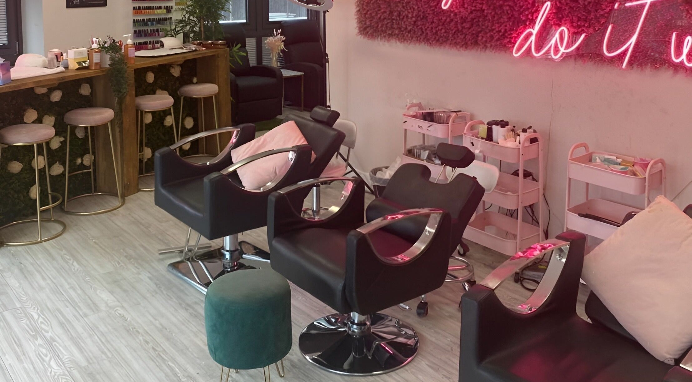 Stylish salon setup at The Beauty House, featuring chic seating and decor in Bristol, England, GB.