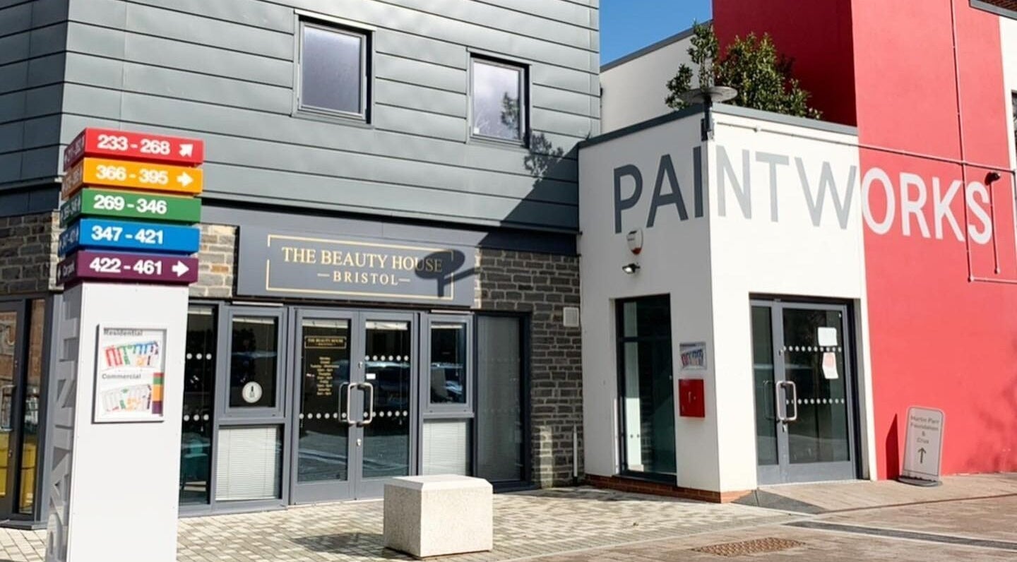 Front view of The Beauty House at Bristol, England, GB with vibrant signages and modern architecture.
