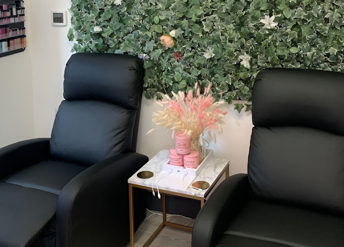 Luxurious chairs and floral decor at The Beauty House, Bristol, England, GB, offering a tranquil retreat.