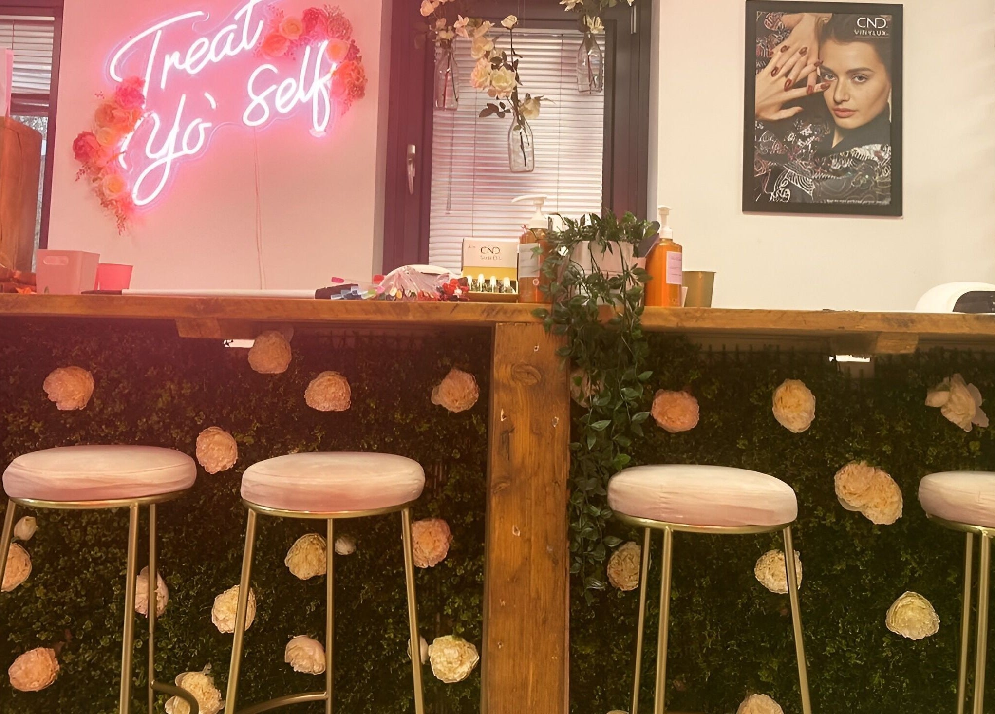 Chic beauty bar with floral decor and neon sign at The Beauty House, Bristol, England, GB.