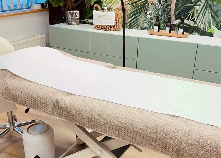 Comfortable treatment bed at StefyBrows, Harpenden, England. Relaxing wellness environment.