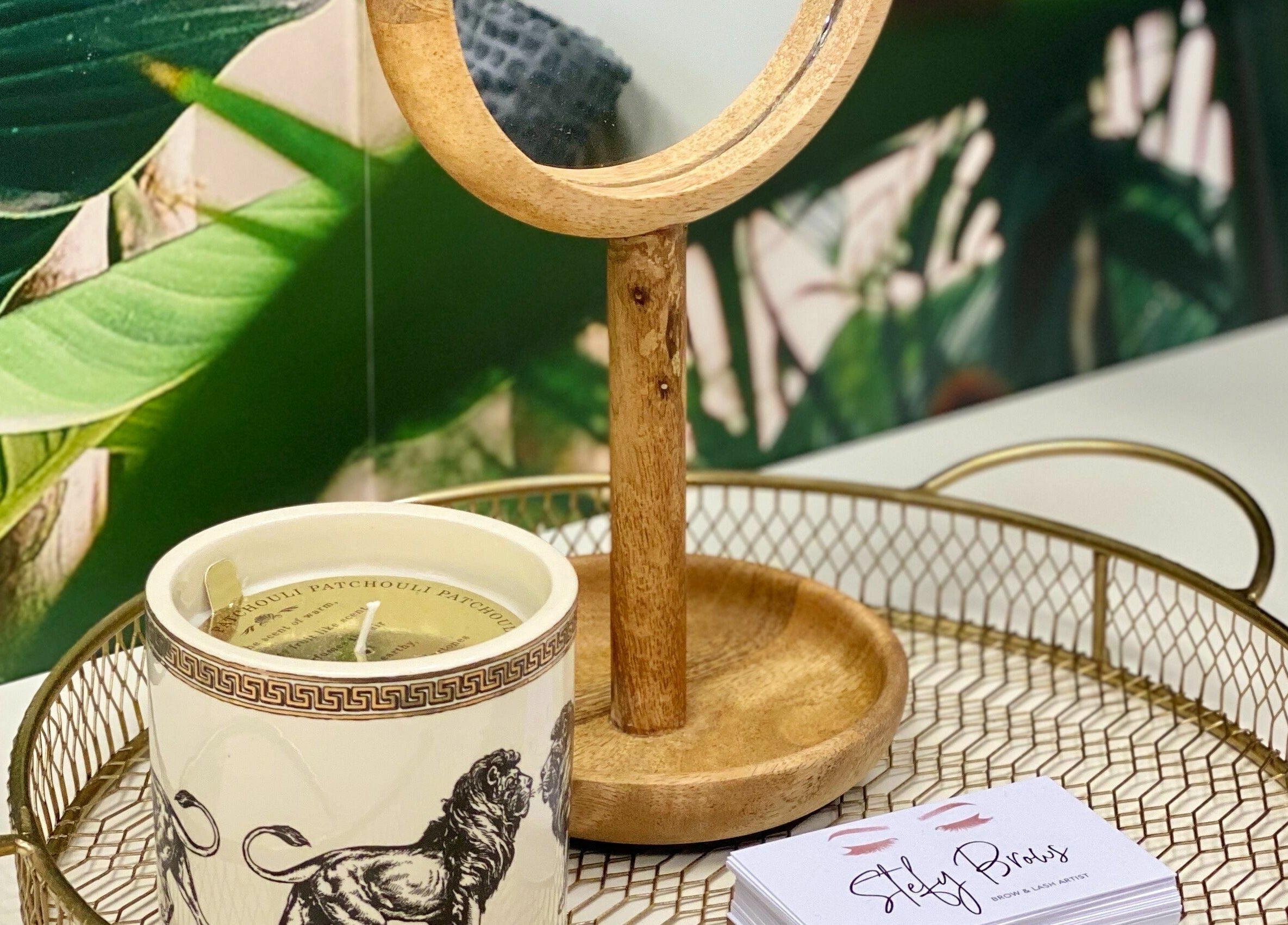 Tranquil setup at StefyBrows, Harpenden, England featuring a decorative mirror and candle.