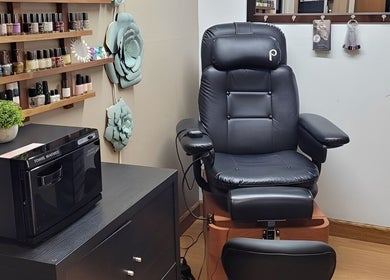 Relaxing nail salon chair and polish selection at Polished Designs by Danielle, Mount Horeb, Wisconsin, US.