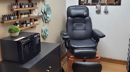 Relaxing nail salon chair and polish selection at Polished Designs by Danielle, Mount Horeb, Wisconsin, US.