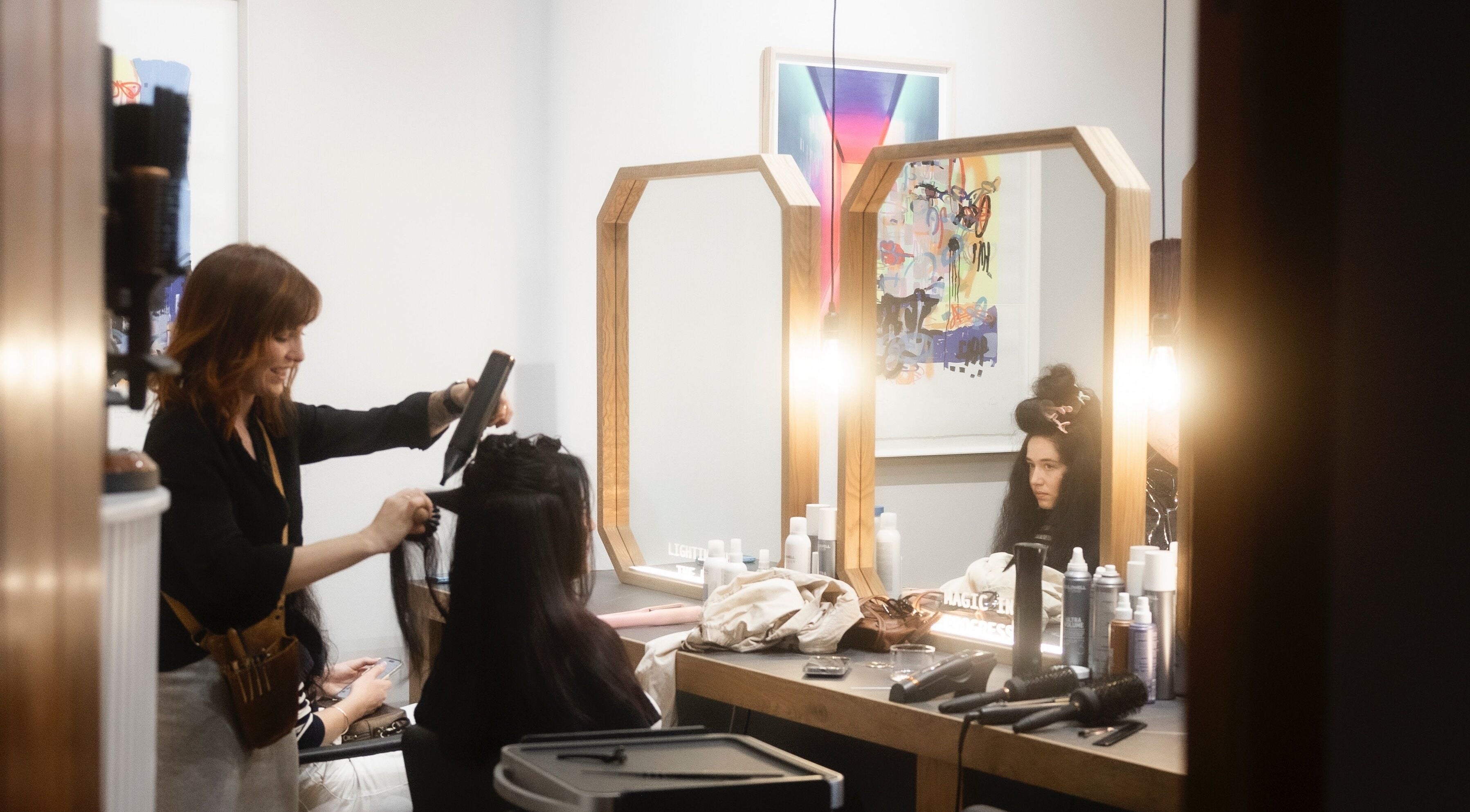 Hair stylist working at Salome the Salon Stellenbosch, Western Cape, ZA, creating a chic hairstyle.