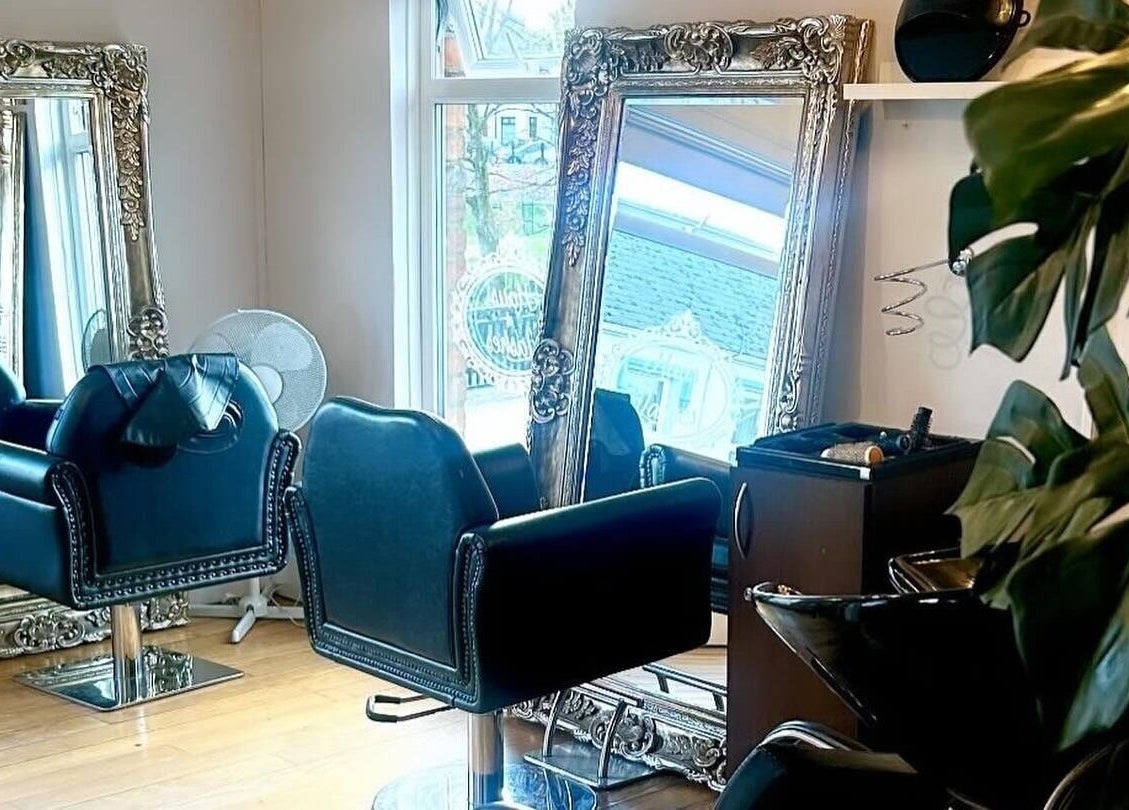 Chic hair styling chairs and ornate mirrors at Claire Scott Professional Hairstylist, Ballyclare, Northern Ireland, GB.