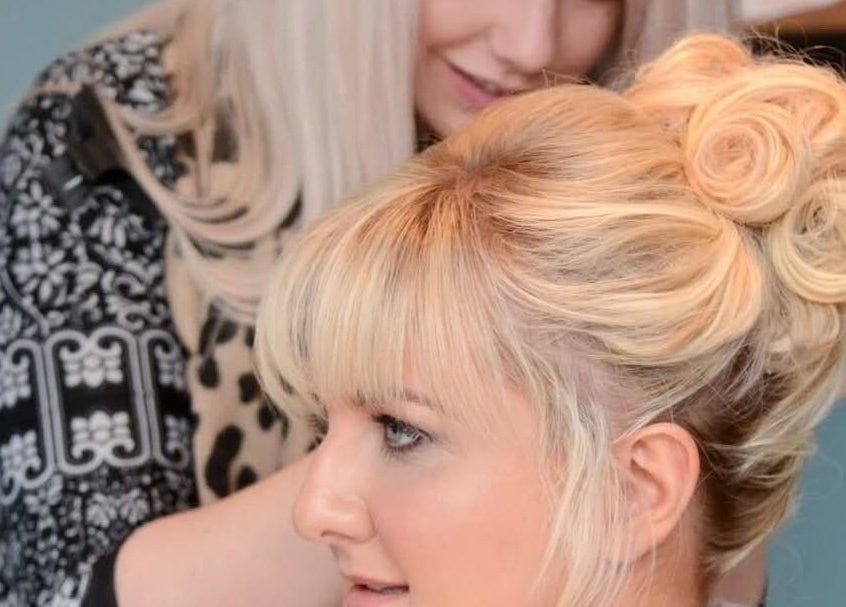 Hairstylist at Claire Scott Professional Hairstylist in Ballyclare, Northern Ireland, GB crafting elegant updo.