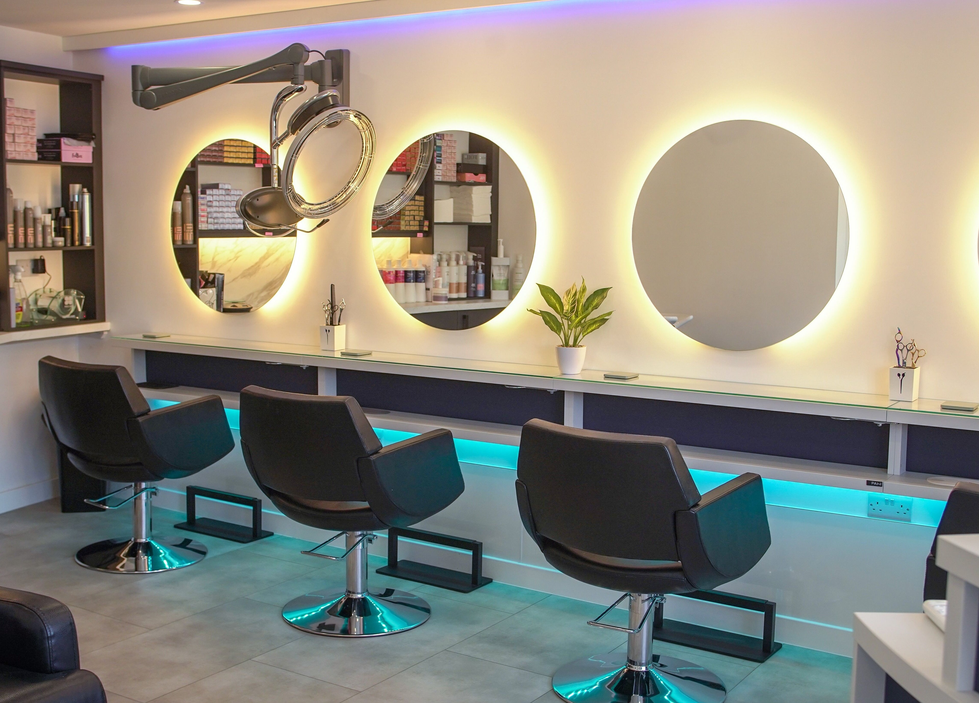 Modern salon chairs and illuminated mirrors at Kaleido Hair & Beauty, Whitwell, England, GB.