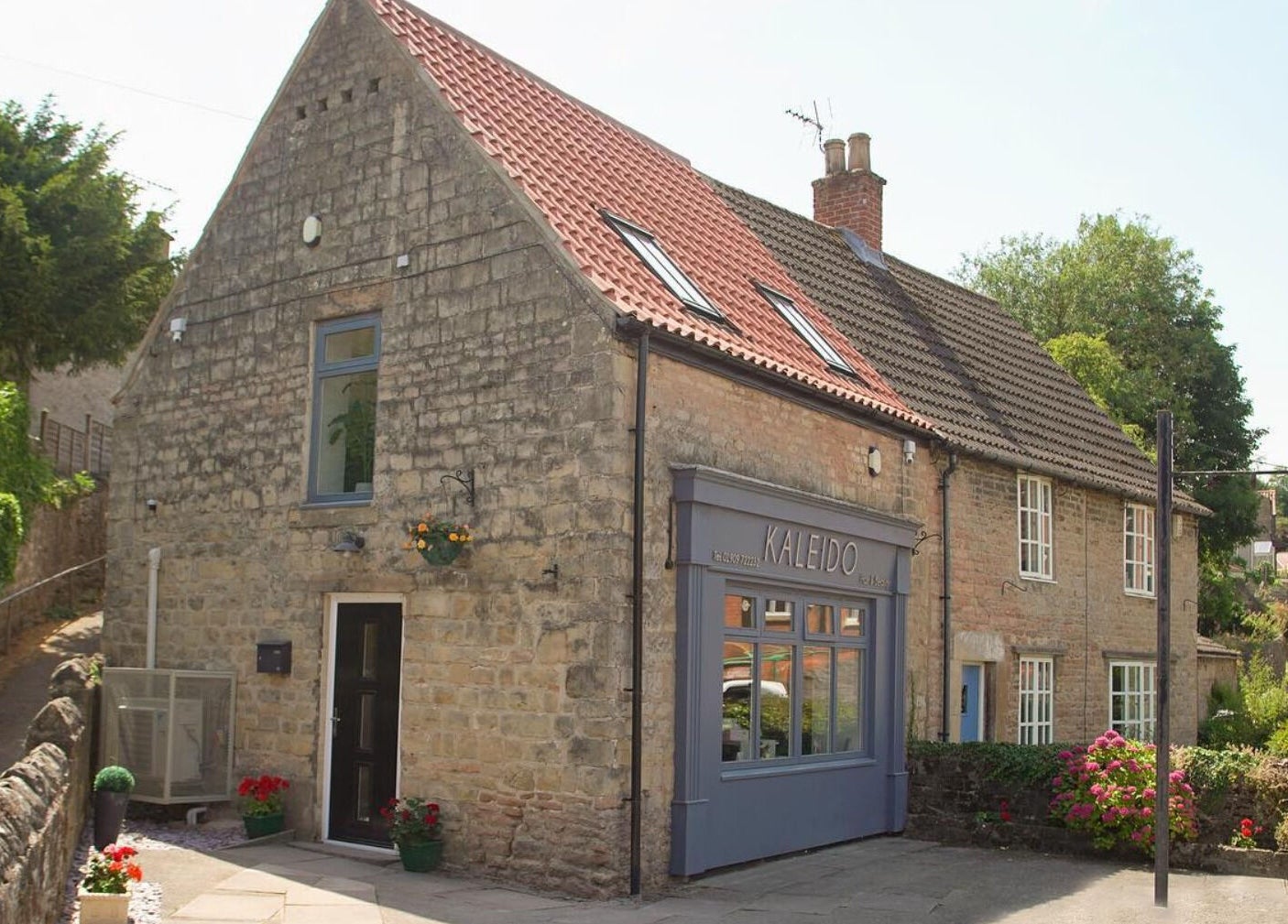 Front view of Kaleido Hair & Beauty, a quaint stone building in Whitwell, England, GB.