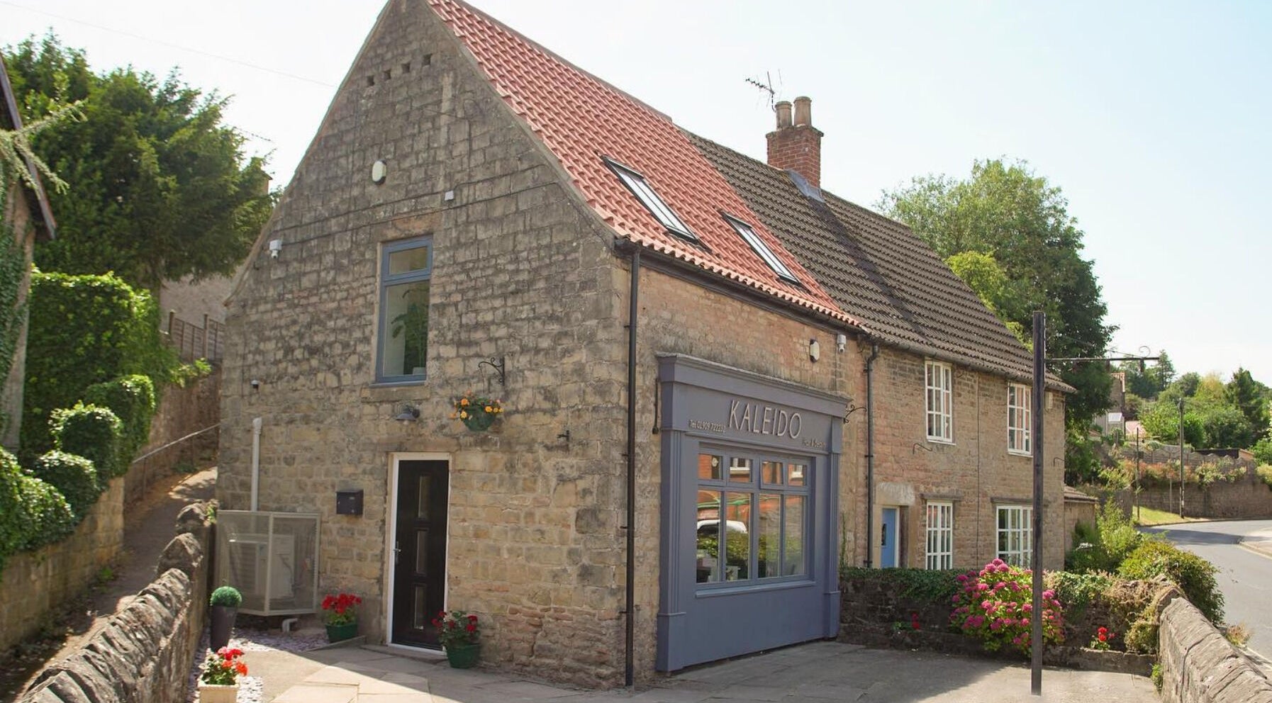 Front view of Kaleido Hair & Beauty, a quaint stone building in Whitwell, England, GB.