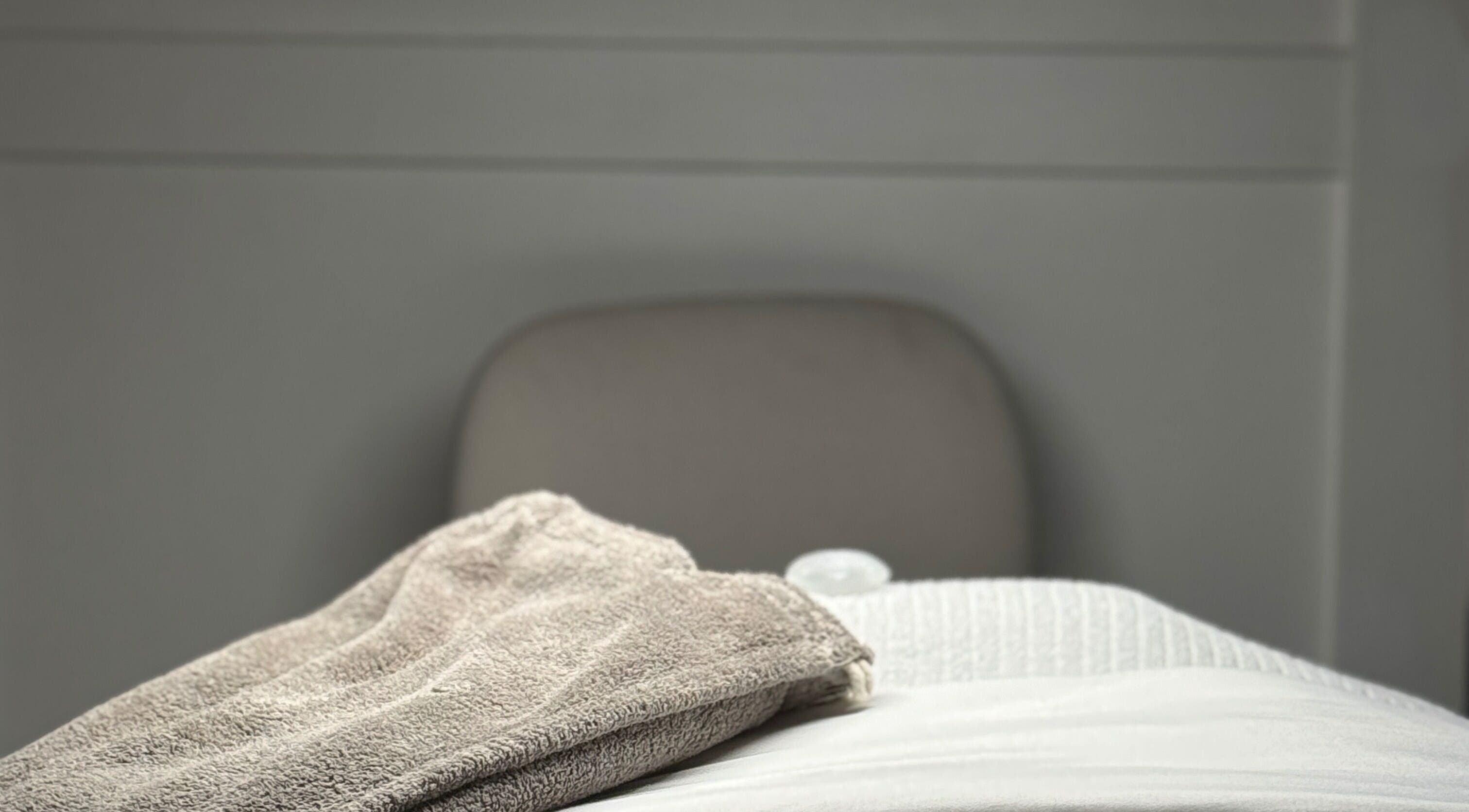 A plush towel on a spa chair at Allyson O’Brien | Nutrition & Advanced Aesthetics, Surrey, British Columbia, CA.