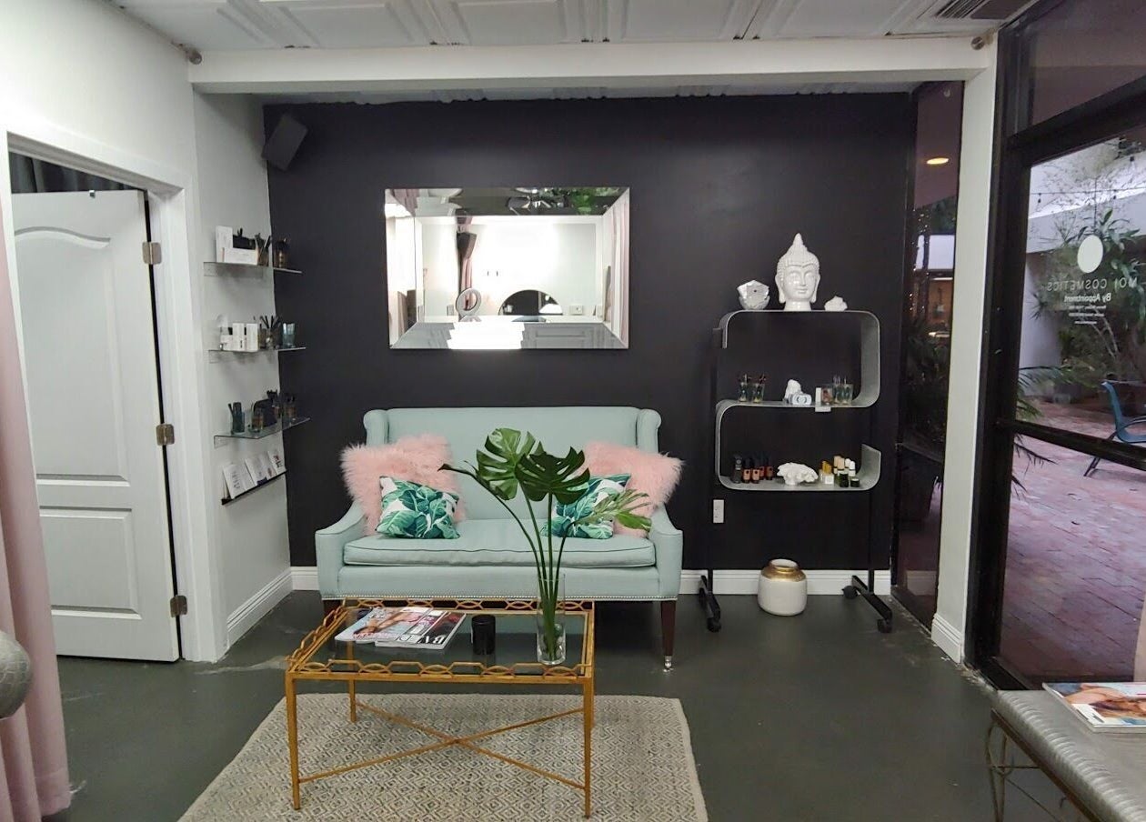 Elegant lounge area at Facelift Lounge, Newport Beach, California with plush seating and modern decor.