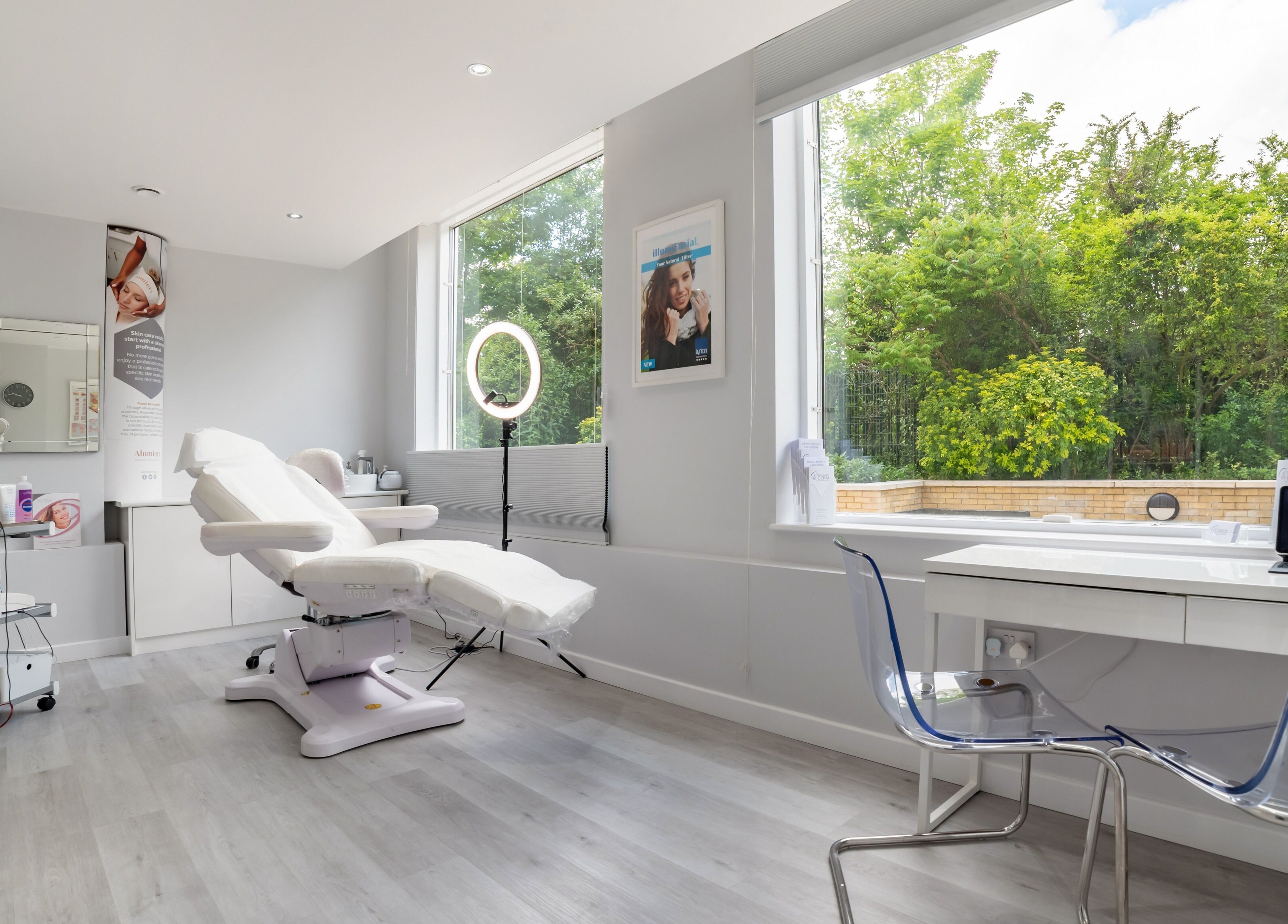 Bright treatment room at In-DERM Skin Clinic Chiswick, London, England, GB, featuring modern equipment.