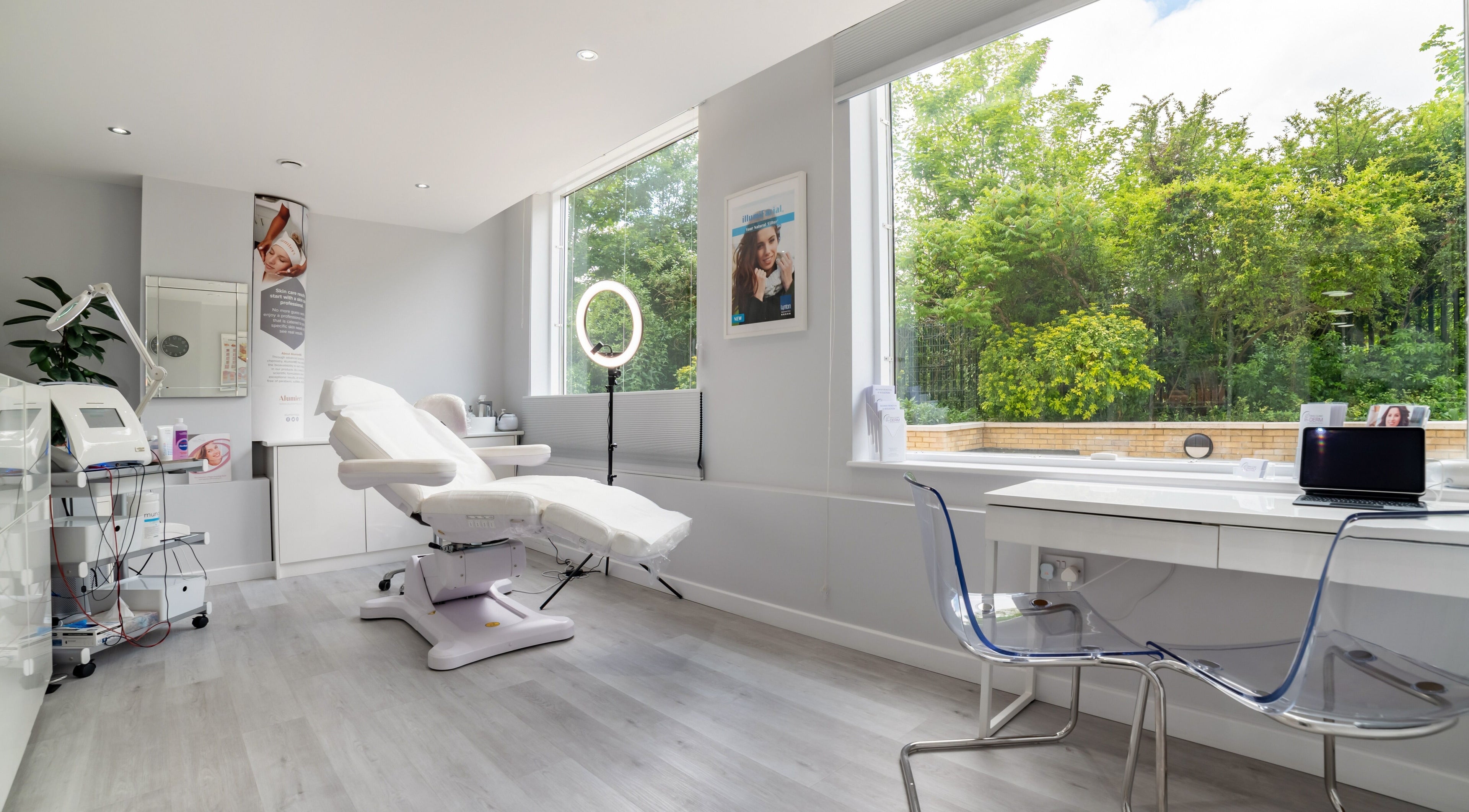 Bright treatment room at In-DERM Skin Clinic Chiswick, London, England, GB, featuring modern equipment.