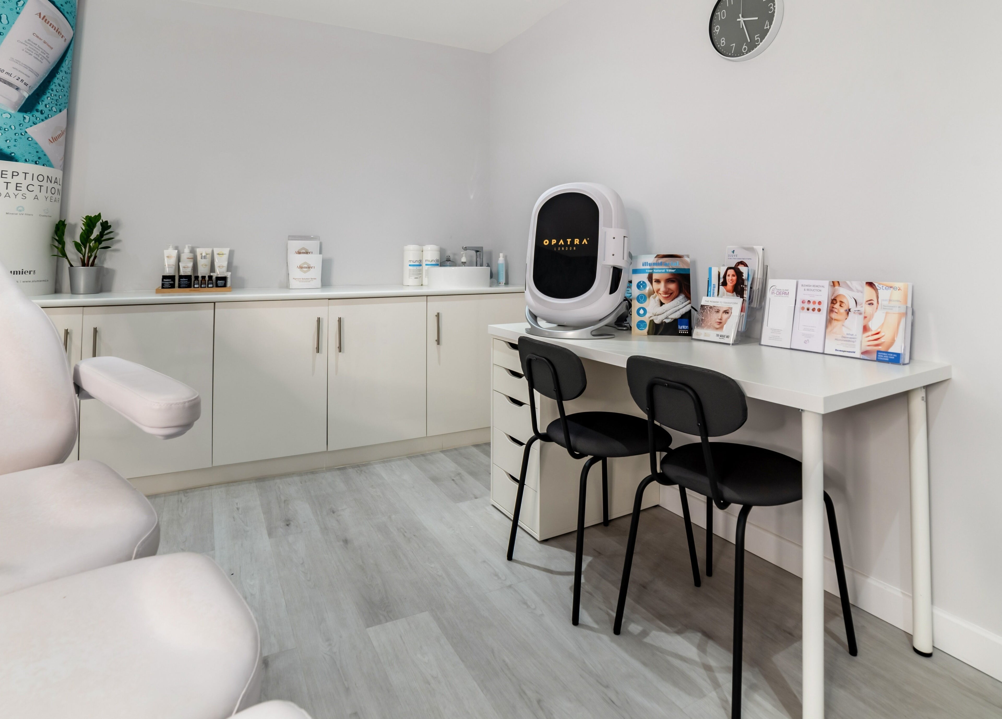 Modern treatment room at In-DERM Skin Clinic Chiswick, London, England, GB, featuring sleek design and advanced equipment.