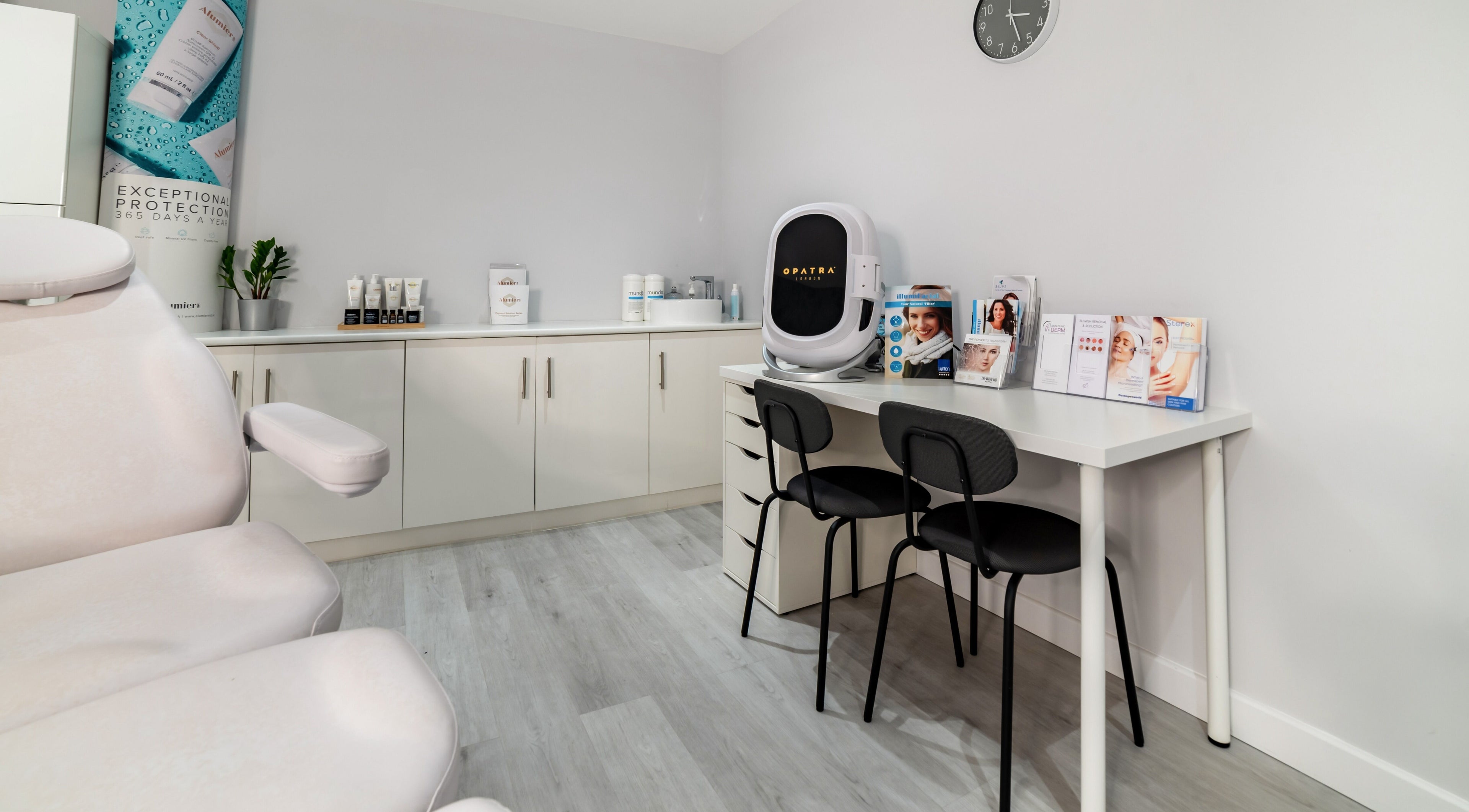 Modern treatment room at In-DERM Skin Clinic Chiswick, London, England, GB, featuring sleek design and advanced equipment.