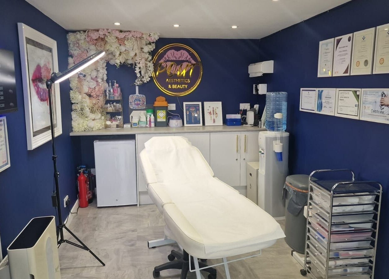 Sophisticated treatment room at Pout Aesthetics and Beauty in Blackpool, England, GB with certificates on display.