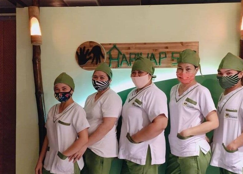 Friendly staff at Hapihap Spa - Legazpi City, Bicol, PH, showcasing welcoming service in a tranquil environment.