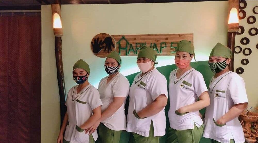 Friendly staff at Hapihap Spa - Legazpi City, Bicol, PH, showcasing welcoming service in a tranquil environment.