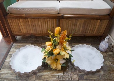 Elegant spa foot bath at Hapihap Spa-Sorsogon City, Sorsogon City, Bicol, PH with flowers and a bamboo seat.