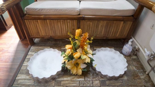 Elegant spa foot bath at Hapihap Spa-Sorsogon City, Sorsogon City, Bicol, PH with flowers and a bamboo seat.