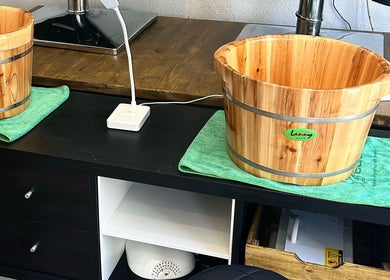 Wooden foot soak tubs at Eden, Palma, Illes Balears, ES offering relaxing wellness experiences.