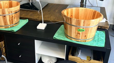 Wooden foot soak tubs at Eden, Palma, Illes Balears, ES offering relaxing wellness experiences.