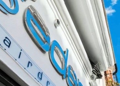Eden's stylish exterior sign in Palma, Illes Balears, ES against a clear blue sky.