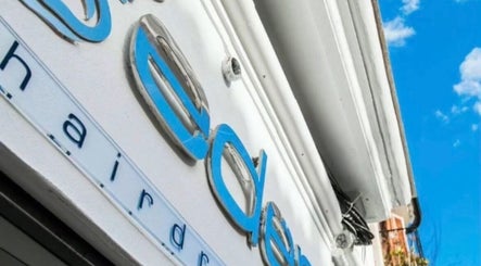 Eden's stylish exterior sign in Palma, Illes Balears, ES against a clear blue sky.