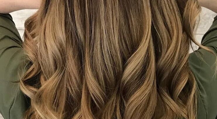 Lustrous golden curls styled at Eden Hair & Nails in Palma, Illes Balears, ES for ultimate hair elegance.