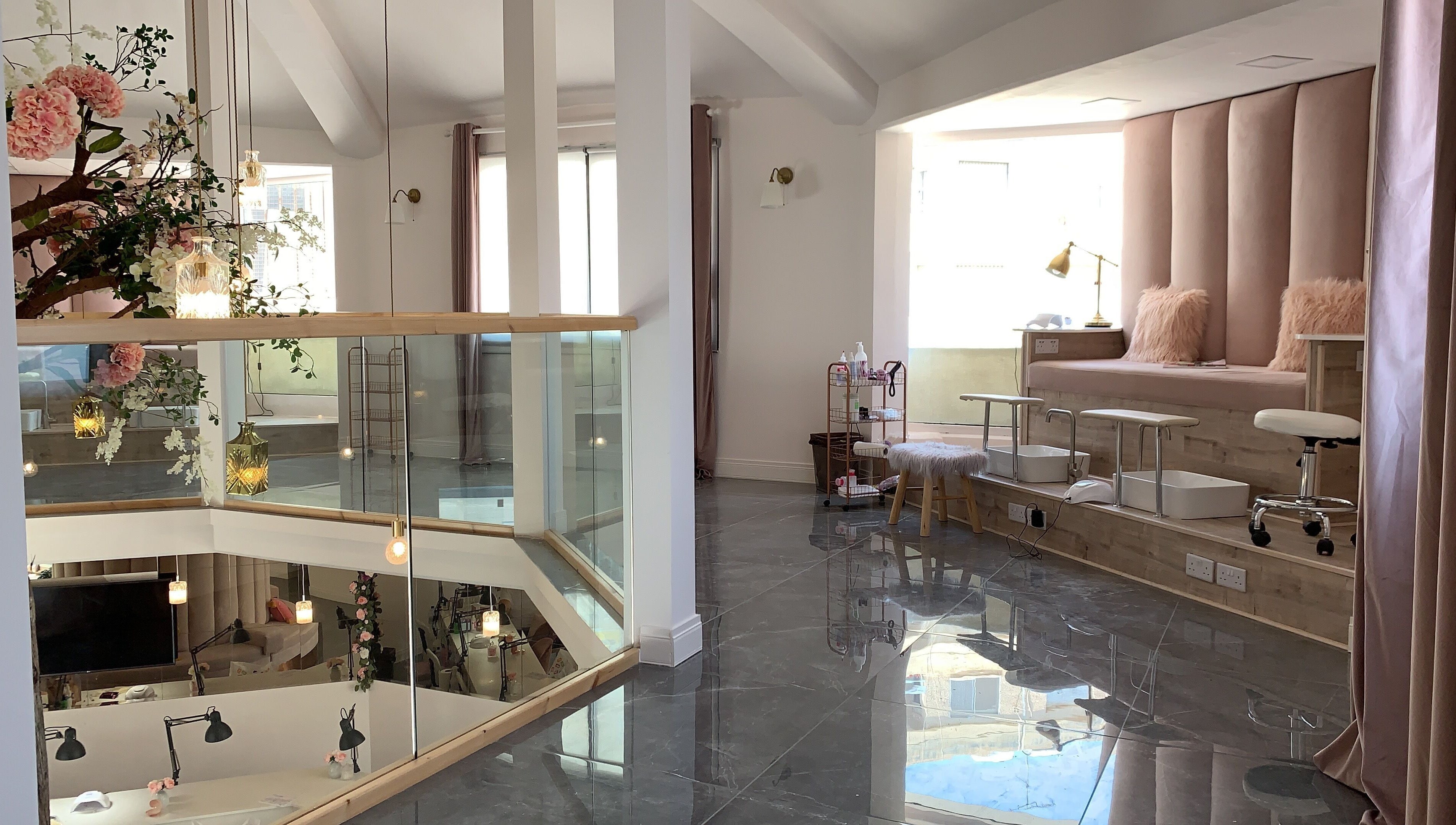 Elegant beauty lounge at NG Dollhouse, Germasogeia, Limassol, CY, showcasing plush seating and stylish decor.