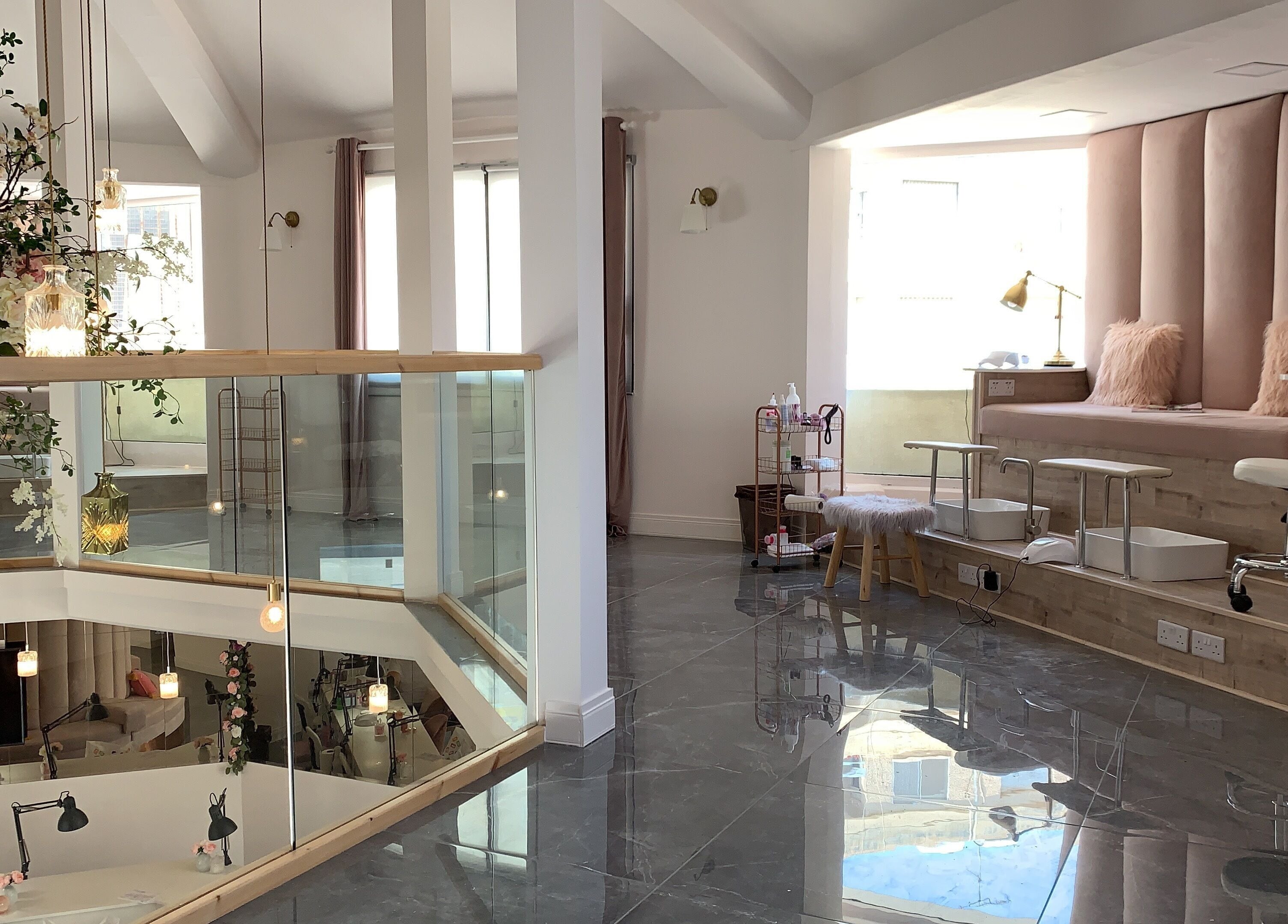 Elegant beauty lounge at NG Dollhouse, Germasogeia, Limassol, CY, showcasing plush seating and stylish decor.