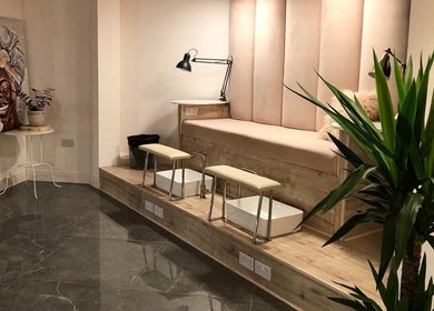 Sophisticated pedicure area at NG Dollhouse, Germasogeia, Limassol, CY with plush seating and modern decor.