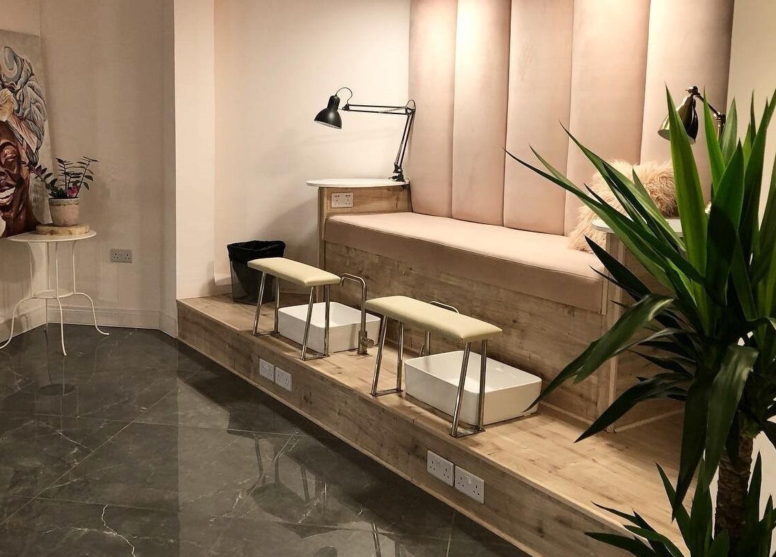 Sophisticated pedicure area at NG Dollhouse, Germasogeia, Limassol, CY with plush seating and modern decor.