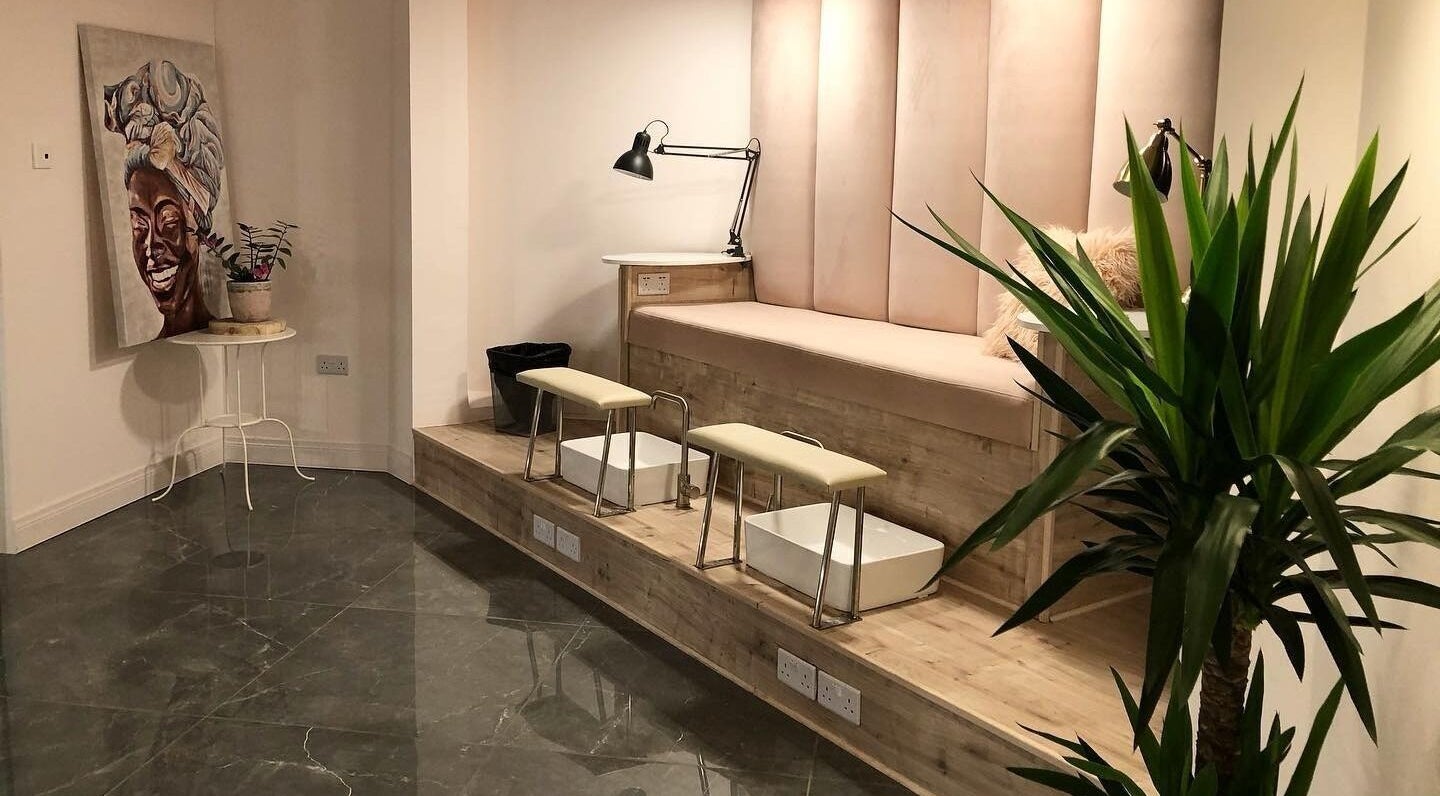 Sophisticated pedicure area at NG Dollhouse, Germasogeia, Limassol, CY with plush seating and modern decor.