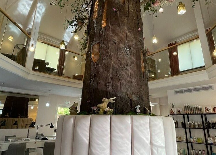 Elegant tree centerpiece at NG Dollhouse, Germasogeia, Limassol, CY, creating a serene wellness ambiance.
