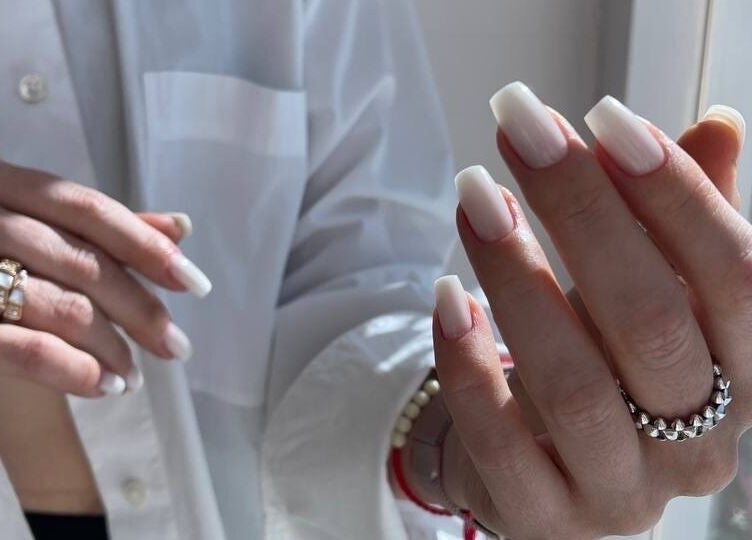 Beautifully manicured nails at NG Dollhouse, Germasogeia, Limassol, CY, showcasing classy white polish.