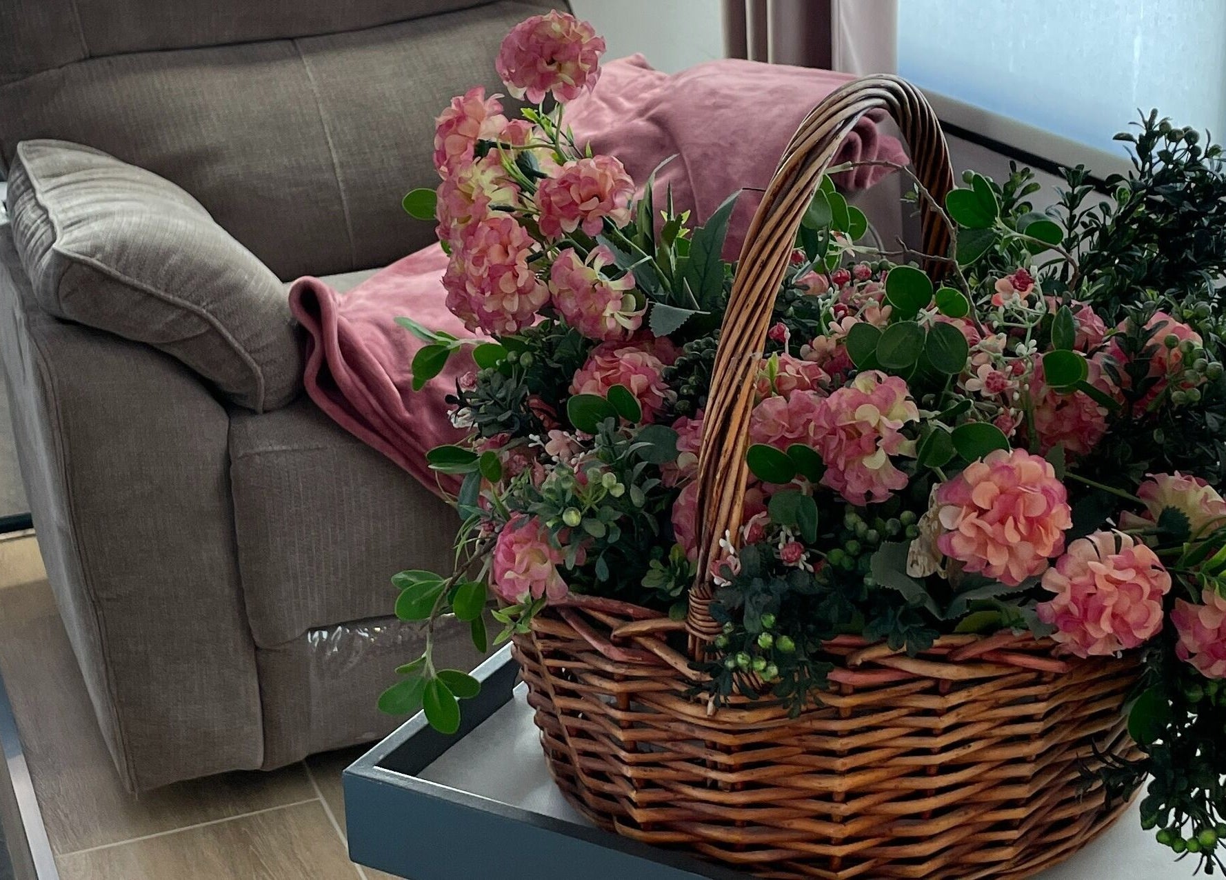 Cozy seating with floral decor at NG Dollhouse, Germasogeia, Limassol, CY.