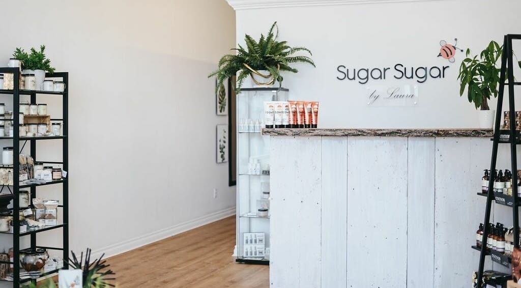 Sugar Sugar by Laura interior with products in Kitchener, Ontario, CA showcasing sleek shelves and a welcoming vibe.