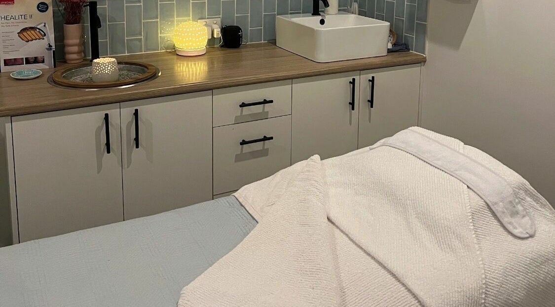 Relaxing treatment room at Azure Skin And Beauty, Terranora, New South Wales, AU with cozy decor and soft lighting.